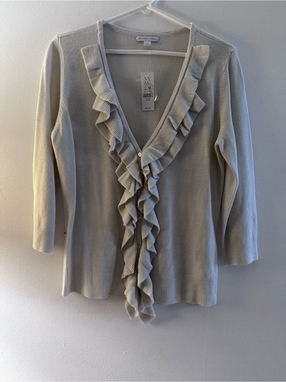 Ruffled V-Neck Cardigan in
Cream color